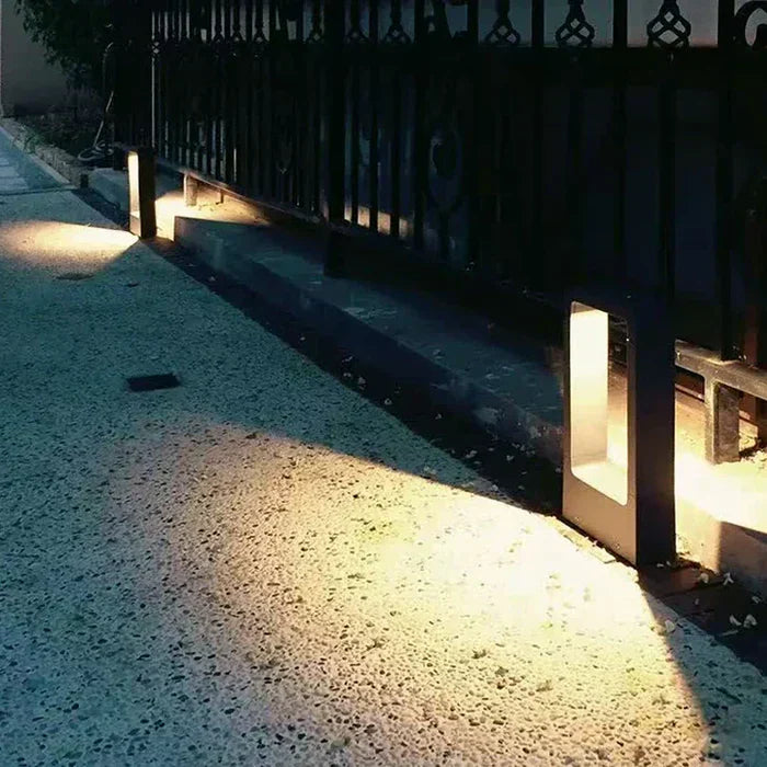 Sleek outdoor LED ground light, modern design for garden, driveway, and pathway illumination.