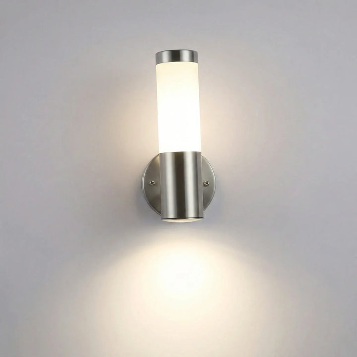 Close-up of a modern black LED outdoor wall sconce with integrated motion sensor.