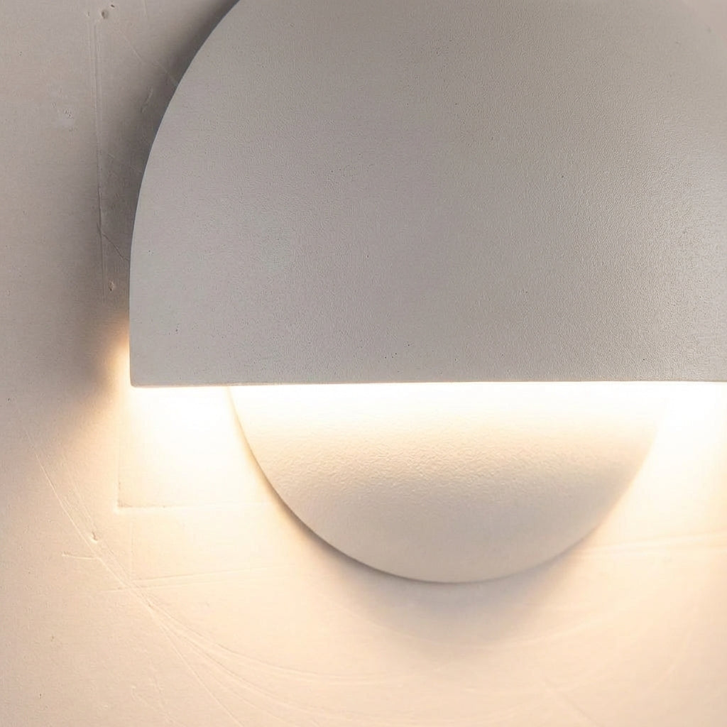 Contemporary LED wall light, outdoor rated, adds modern touch to home, bright and efficient lighting