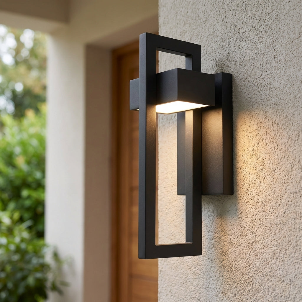 Modern LED outdoor wall light, sleek black aluminum, illuminates entrance, energy efficient LumaVell fixture.