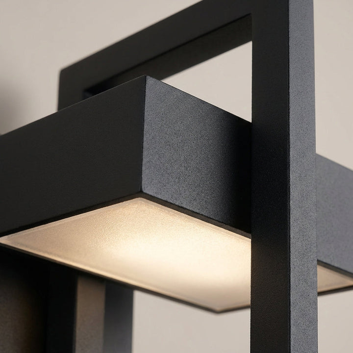 Sleek black modern LED outdoor wall light, durable aluminum construction, ideal for entrance illumination.
