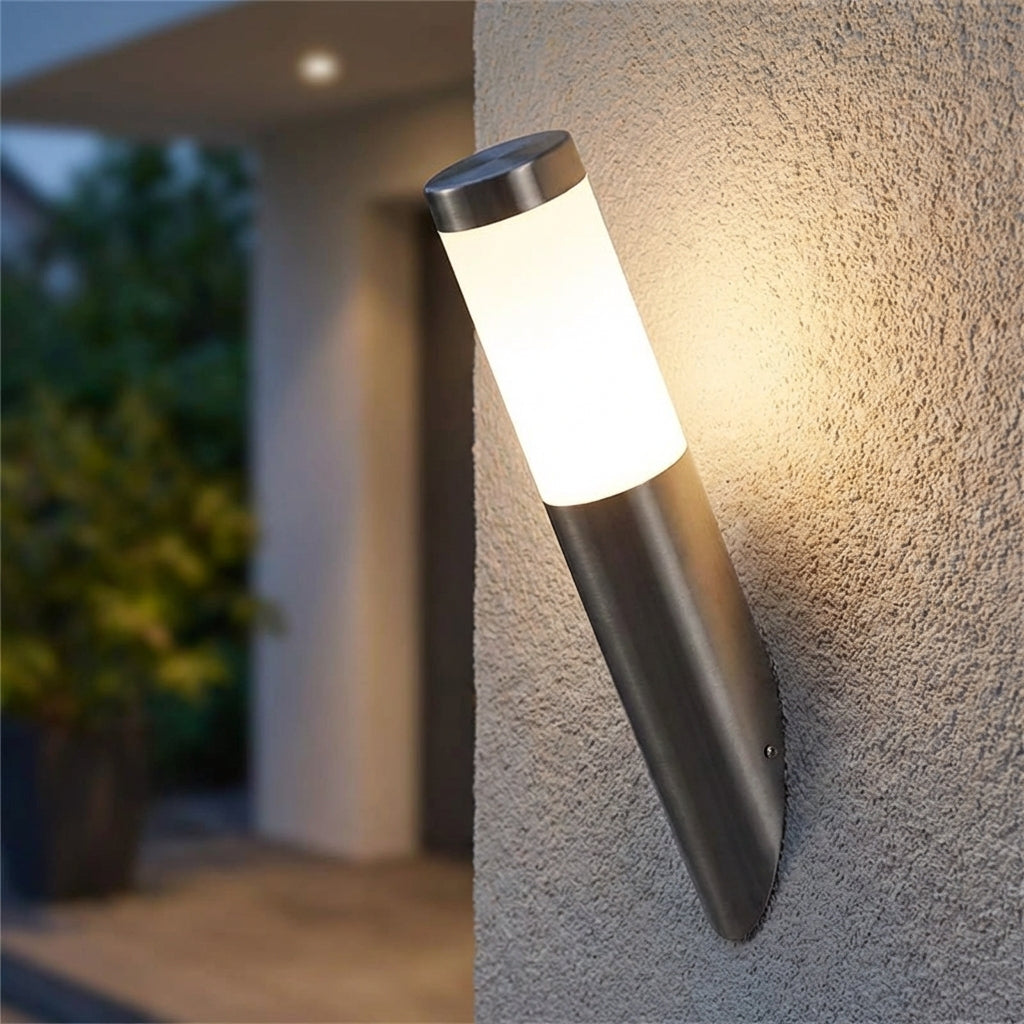 Modern LED outdoor wall sconce with motion sensor in sleek black finish, illuminating a home exterior.