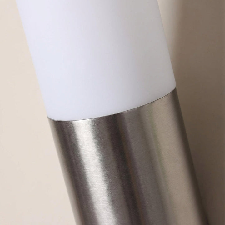 Contemporary weatherproof LED wall light with integrated motion sensor, perfect for modern home exteriors.