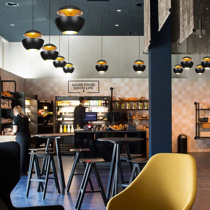 AstraGlow modern LED pendant, enhancing living room decor with stylish light.