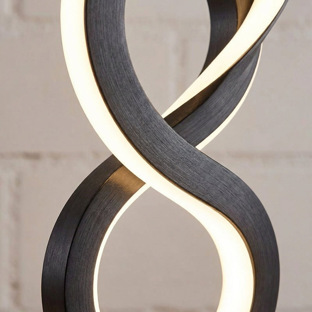 Energy-saving LED spiral table lamp in a sculptural form, enhancing any room's decor.