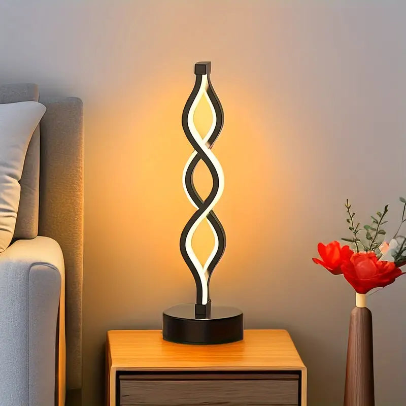 Stylish Spirique spiral table lamp with integrated LED lighting, ideal for contemporary home decor.