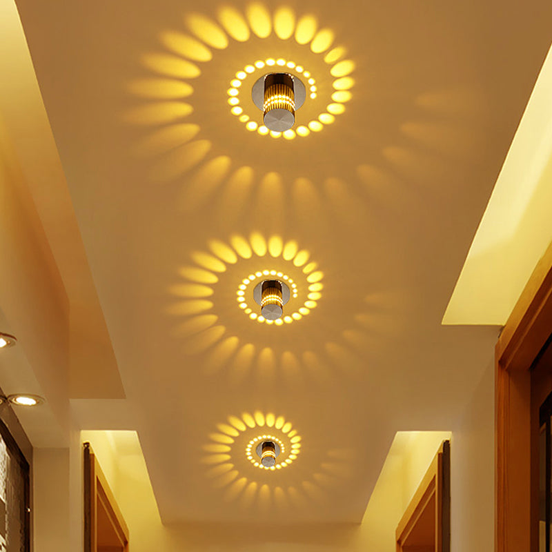 Energy-efficient modern LED spiral light fixture mounted on a neutral-colored wall.