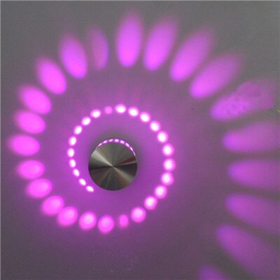 Abstract LED spiral artwork on a ceiling, creating a unique visual effect, home decor