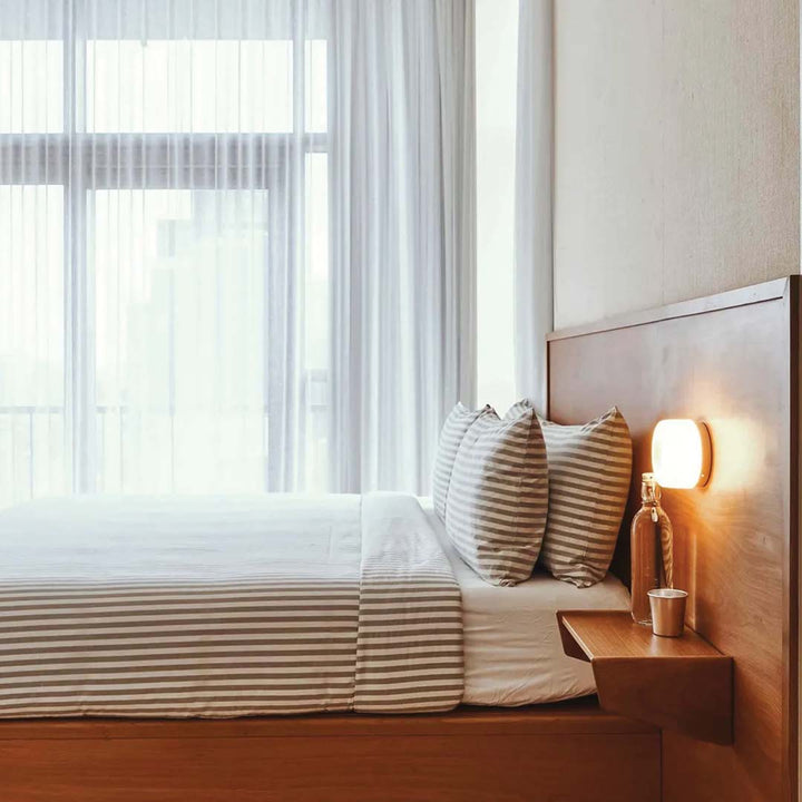 Stylish LED wall lamp, ideal for creating modern home ambiance. Hardwired interior lighting solution.