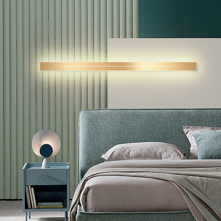 Elegant gold LED wall lamp, perfect for bedroom lighting and modern aesthetics.
