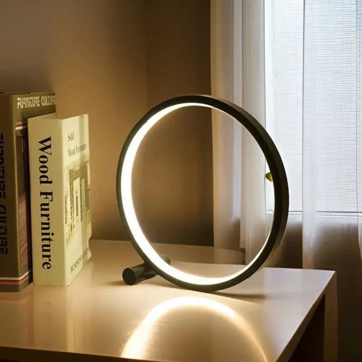 Circular LumaCircle LED night light. Dimmable modern table lamp for soft, ambient lighting and minimalist decor.