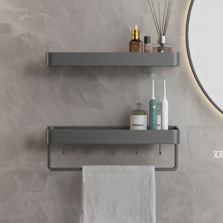 Functional matte gray floating shelf organizing toiletries and small bathroom items