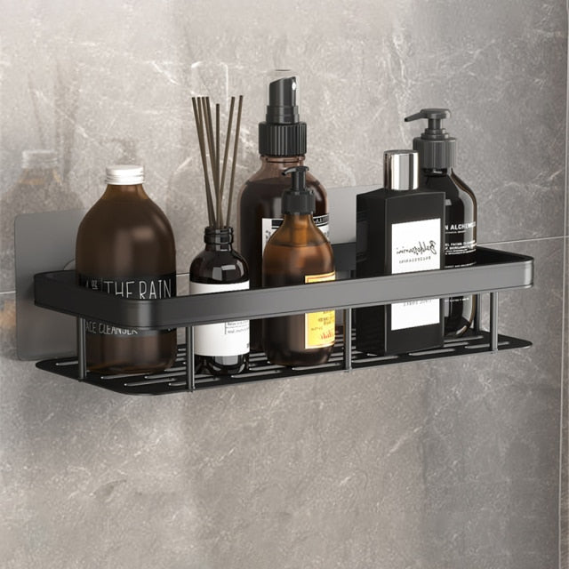 Modern metal suction cup shelf for bathroom storage. No-drill shower organizer, sleek design.