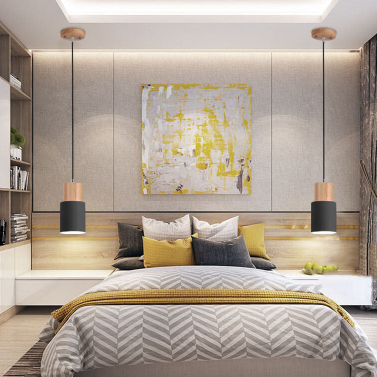Installed minimalist LED cylinder pendant lamp, sleek overhead lighting solution.