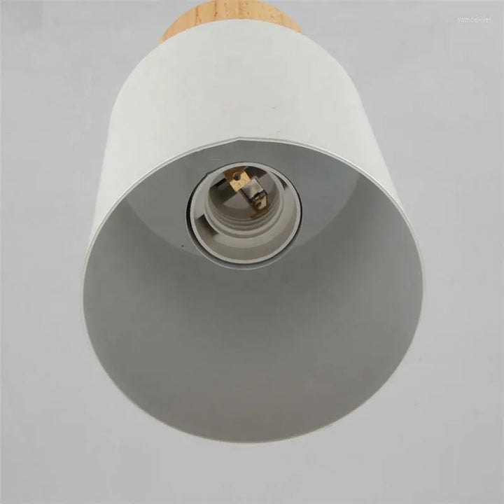 Angled view of modern minimalist LED cylinder pendant lamp, chic home lighting fixture.
