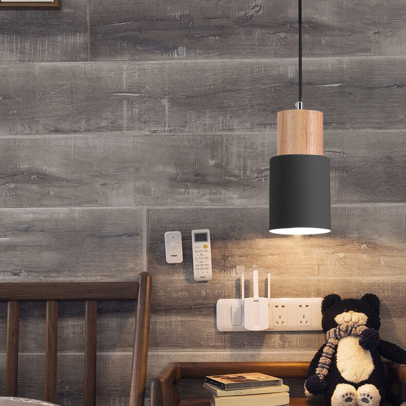 Minimalist LED cylinder pendant lamp creating ambient modern lighting in a contemporary space.