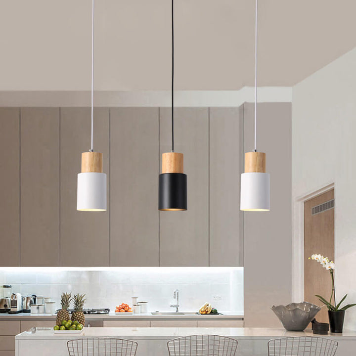Close-up of minimalist LED cylinder pendant lamp, showcasing aluminum finish.
