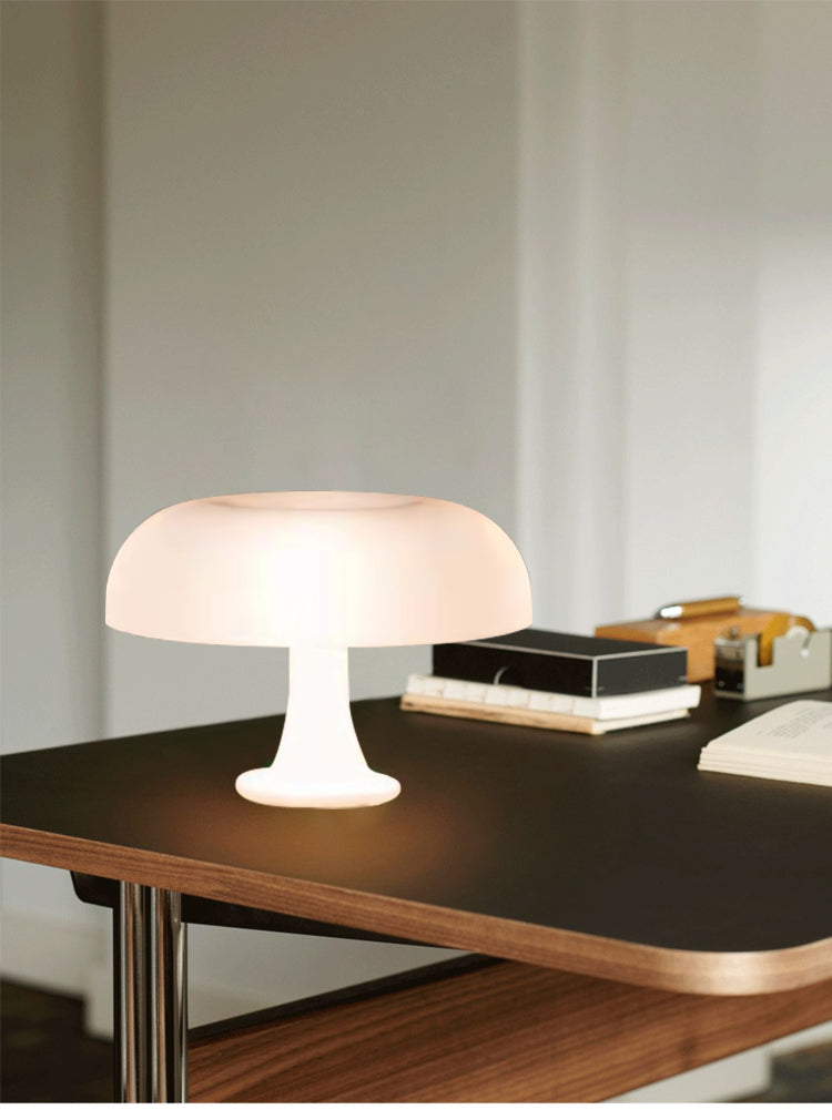 Designer LED toadstool bedside lamp, sleek minimalist lighting for a modern bedroom aesthetic.