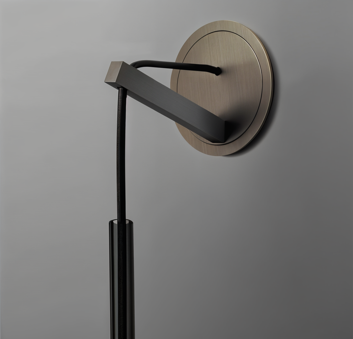 Sleek minimalist wall lamp with a sophisticated smoked glass globe, enhancing modern interior design.