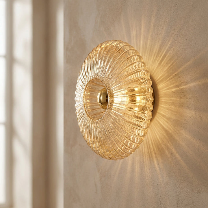 Modern minimalist wall sconce with clear glass shade, ideal for modern home decor.