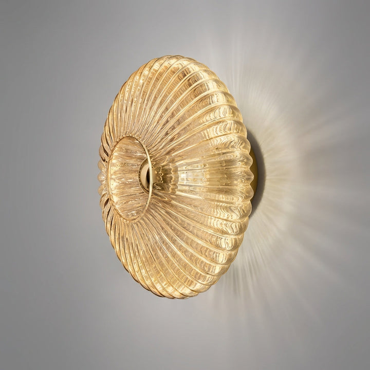 Aurafold glass wall sconce, minimalist design for ambient indoor lighting.