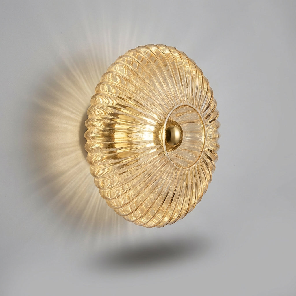Contemporary glass wall sconce by Aurafold, enhances living room with minimalist lighting.