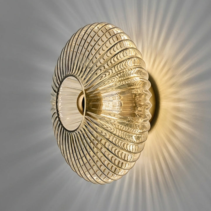 Minimalist wall sconce, a stylish glass light fixture for modern interior decor.