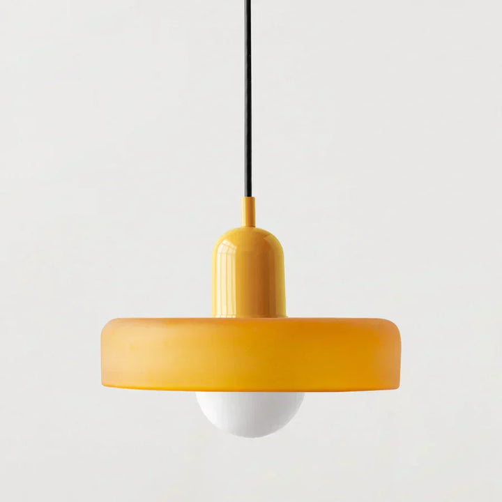 Sleek modern pendant light, clear glass globe, perfect for entryways.