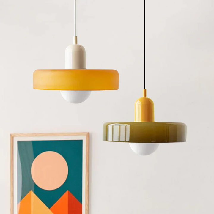 Sleek modern hanging lamp, black metal finish, enhances any home interior.