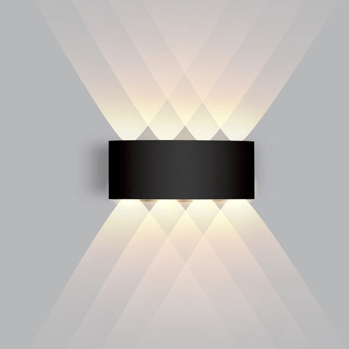 Sleek outdoor LED wall light, weatherproof and modern, ideal for illuminating gardens.