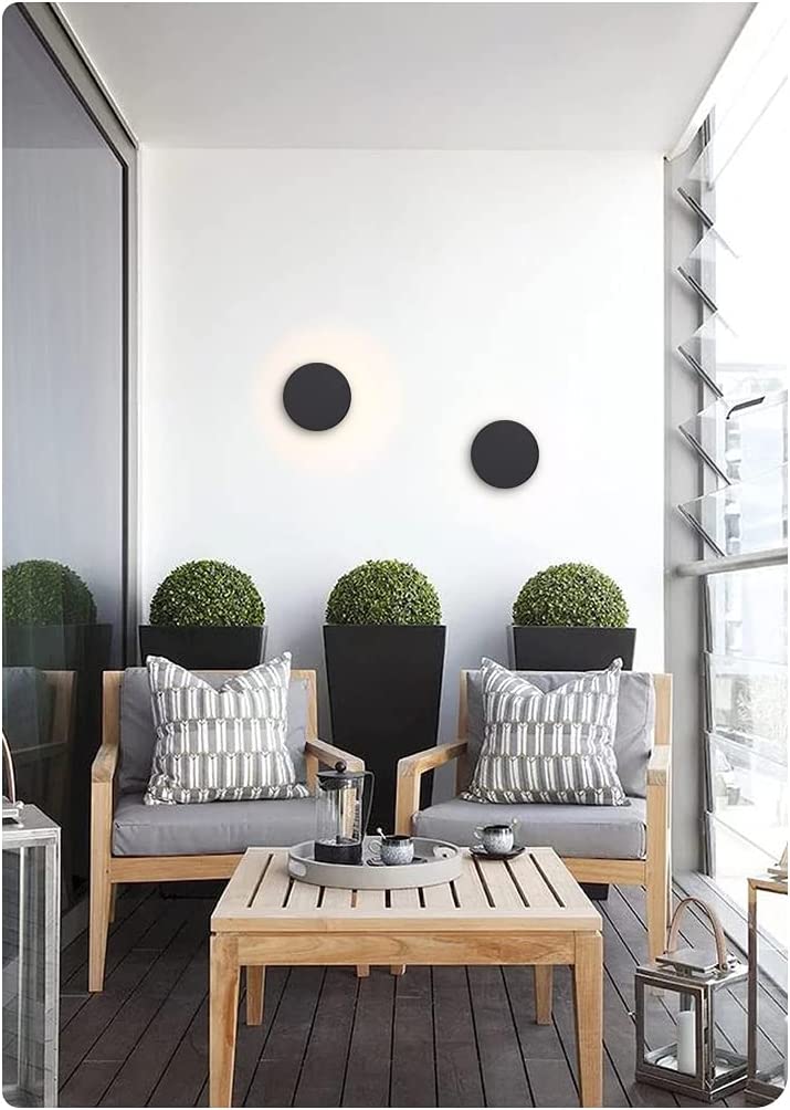 Waterproof modern round outdoor wall light from Solunex, stainless steel fixture, ideal garden lighting.