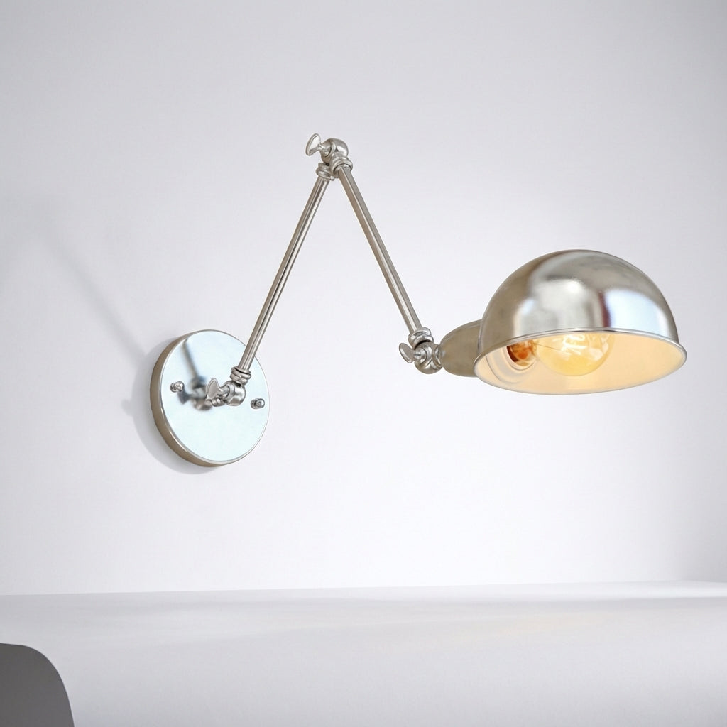 Polished silver swing arm wall lamp, providing adjustable lighting for stylish home decor