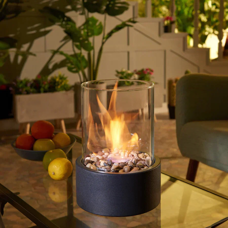 Modern portable tabletop fire pit, ideal for indoor or outdoor ambiance. Eco-friendly ethanol flame.
