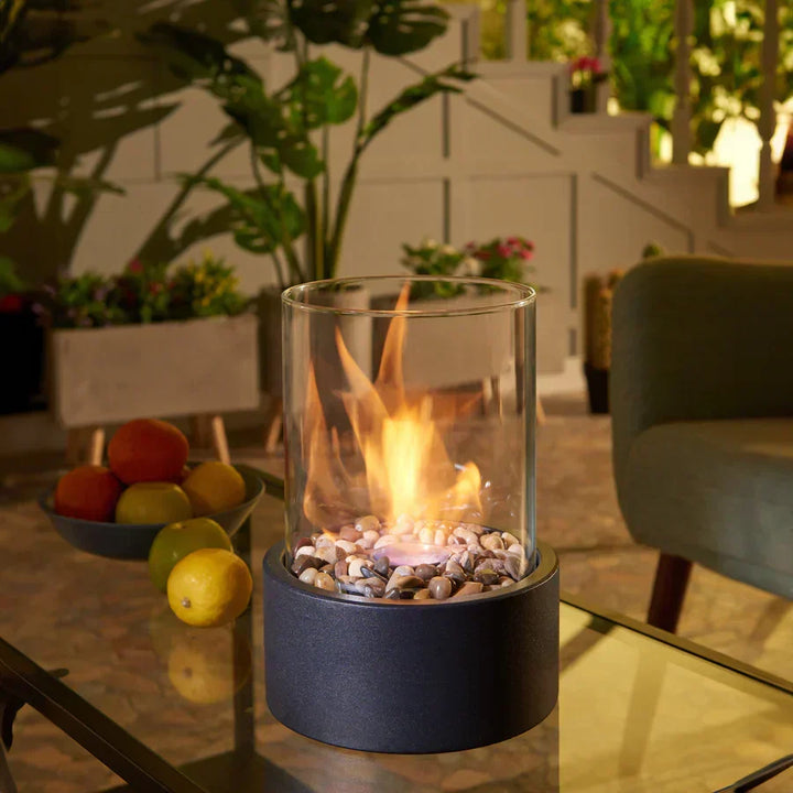 Modern portable tabletop fire pit, ideal for indoor or outdoor ambiance. Eco-friendly ethanol flame.