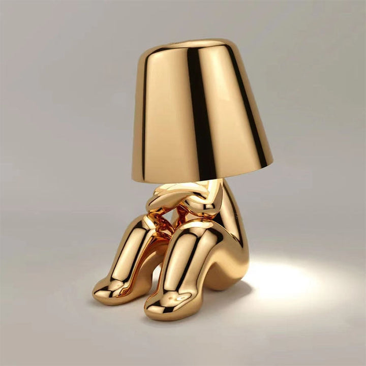 Stylish gold metal LED accent lamp. Rechargeable, touch control for modern home decor and ambiance.