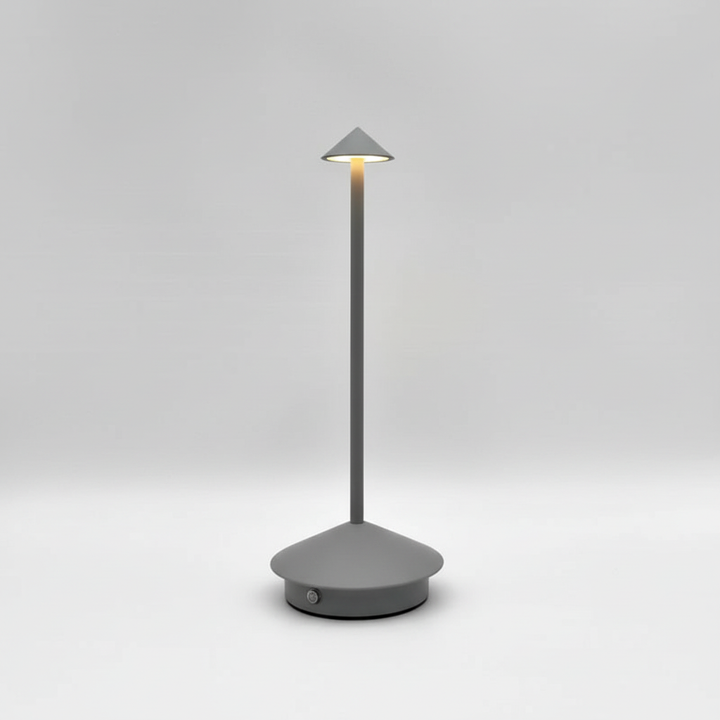 Elegant modern LED table lamp, rechargeable & portable. Cordless aluminum design for ambient mood lighting.