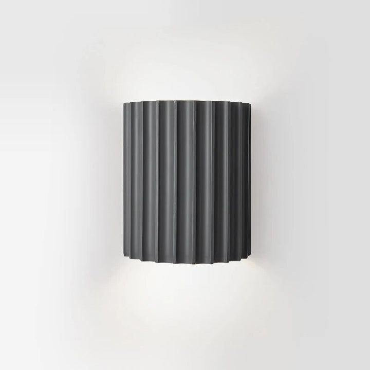 Modern LED resin wall lamp for stylish home decor, providing warm ambient light in bedrooms or corridors.