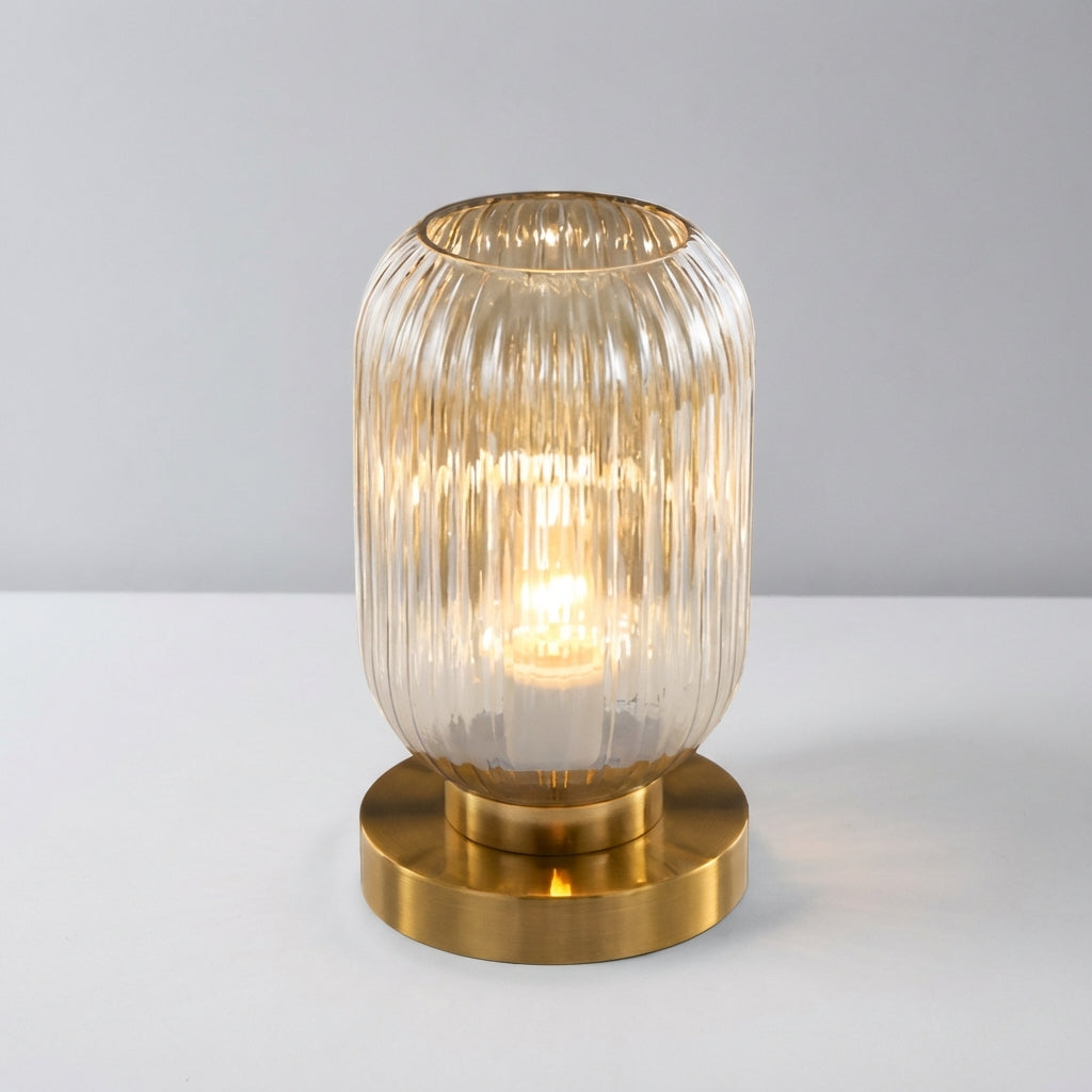 Close-up of a modern Glintora ribbed glass table lamp, showcasing the unique texture and LED compatibility.