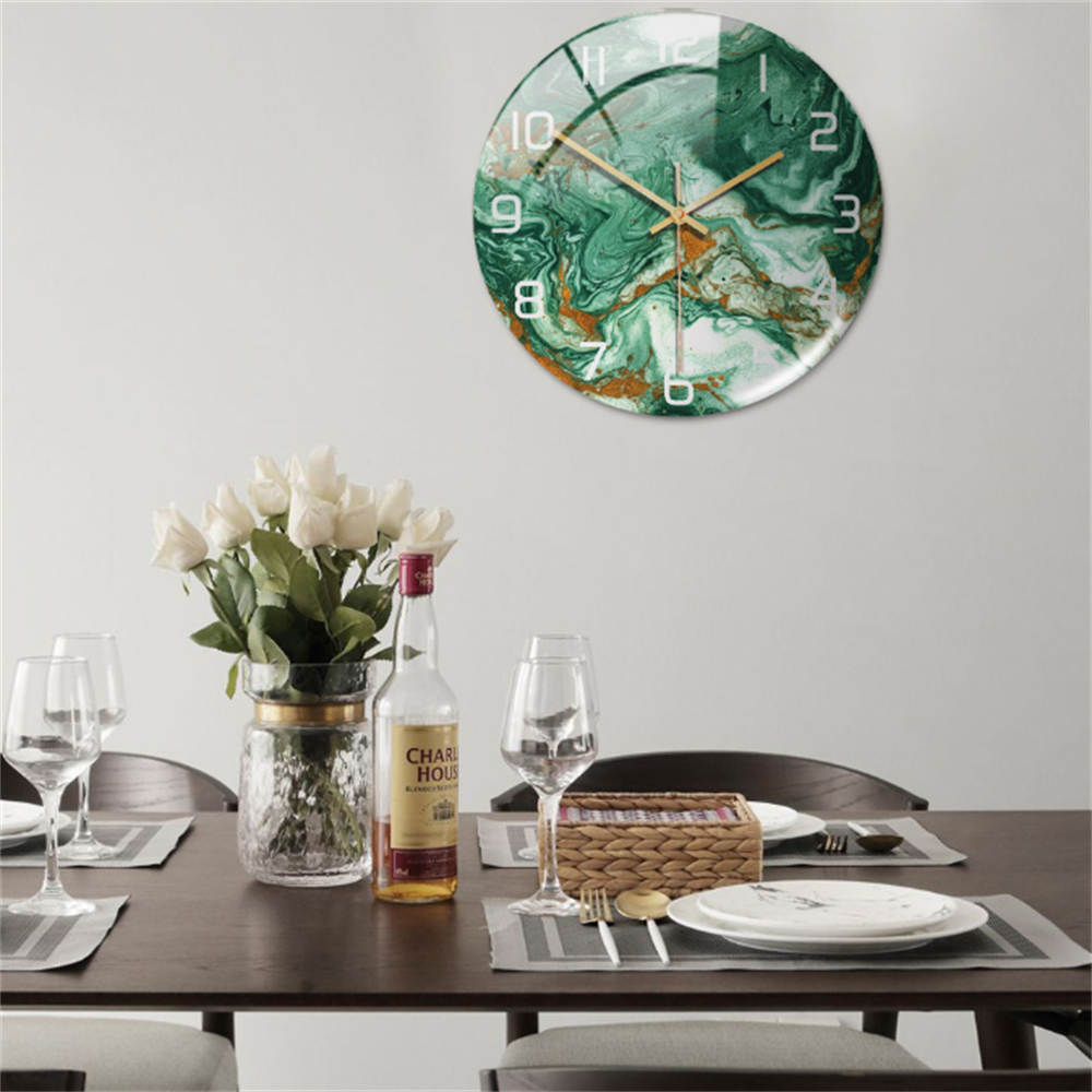 Modern round wall clock, elegant faux marble design, enhances contemporary home decor.
