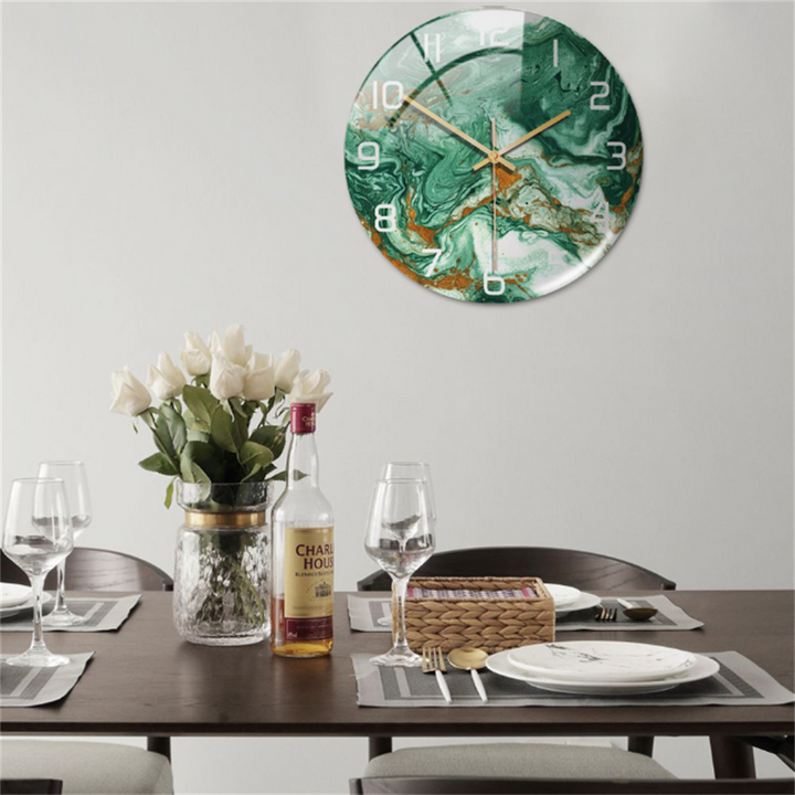 Modern round wall clock, elegant faux marble design, enhances contemporary home decor.