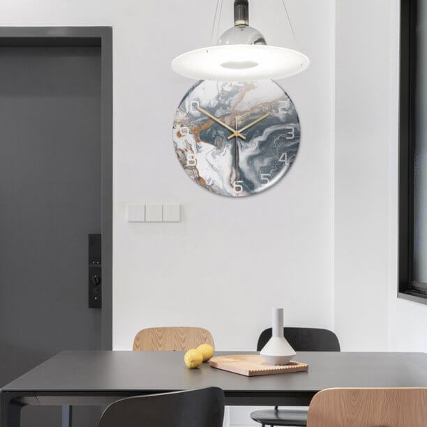 Stylish faux marble round wall clock, a modern decorative piece for living rooms.