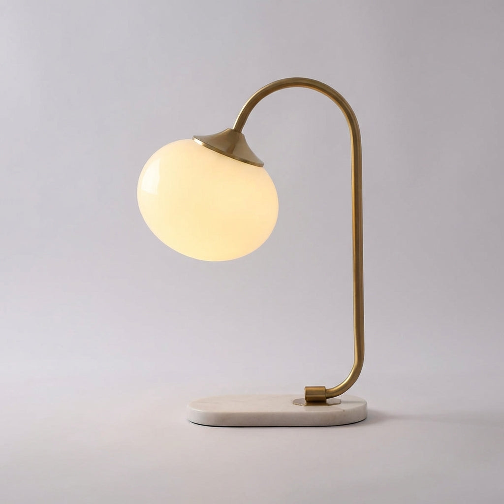 Melluma modern rounded table lamp, sleek design. Ideal bedroom or living room decorative lighting solution.