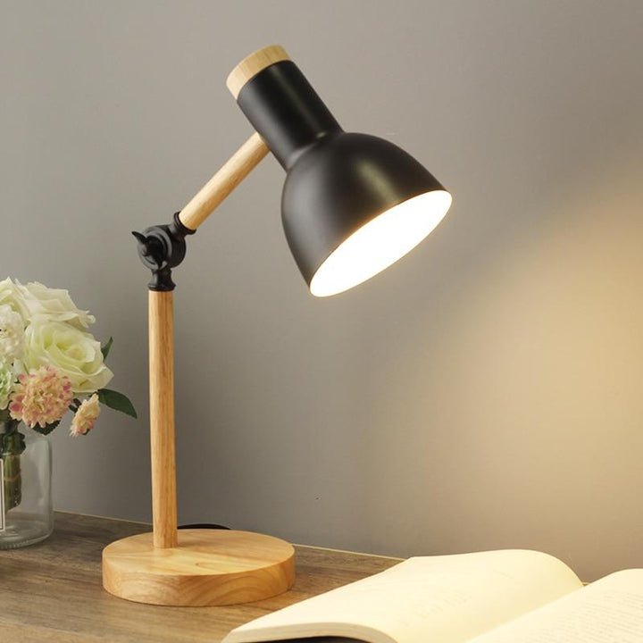 Adjustable modern wood desk lamp with a colorful shade. Ideal accent lighting for any Scandinavian space.