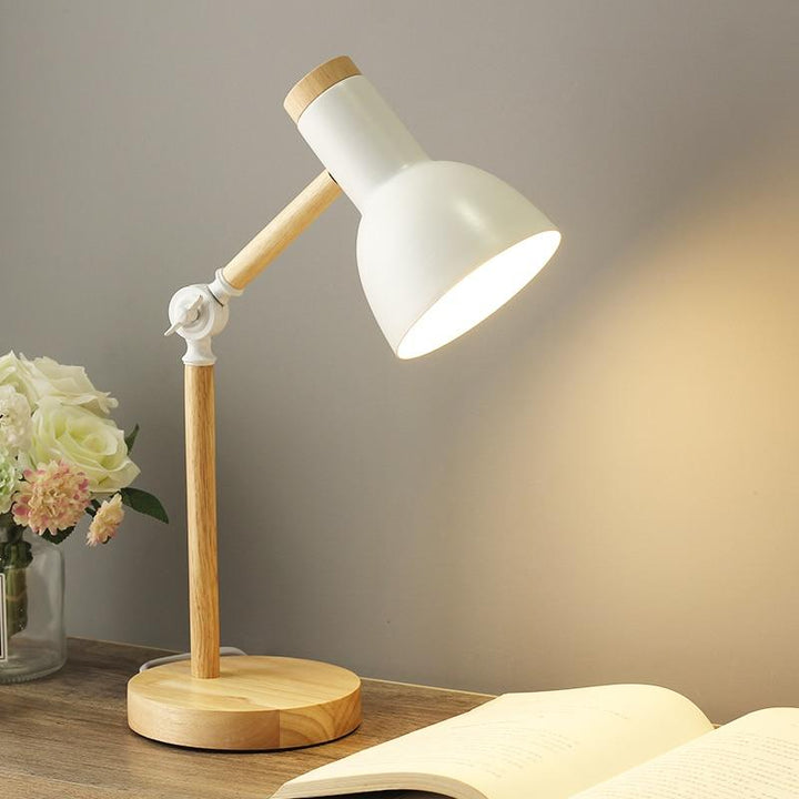Sleek Scandinavian wood desk lamp, great for an office or study. Combines modern lighting with natural wood.