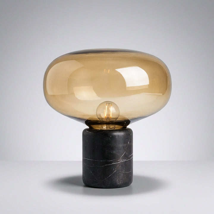 Aurablock postmodern table lamp with unique sculptural design and elegant marble base on a table.