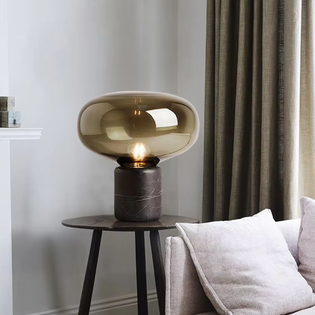 Close-up of Aurablock table lamp's marble base, highlighting the luxurious material and craftsmanship.