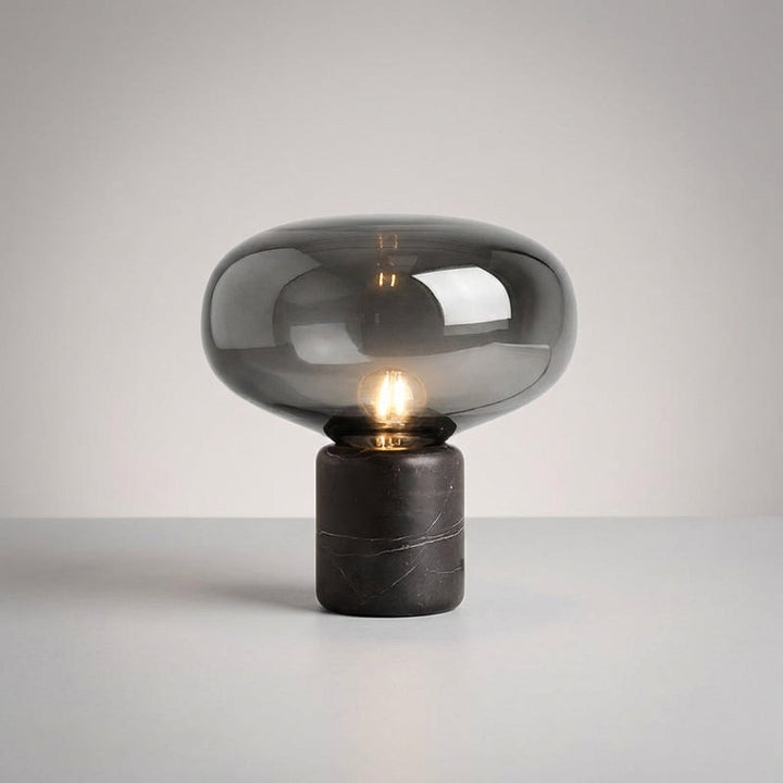 Stylish Aurablock table lamp, a focal point with its sculptural design and premium marble base.
