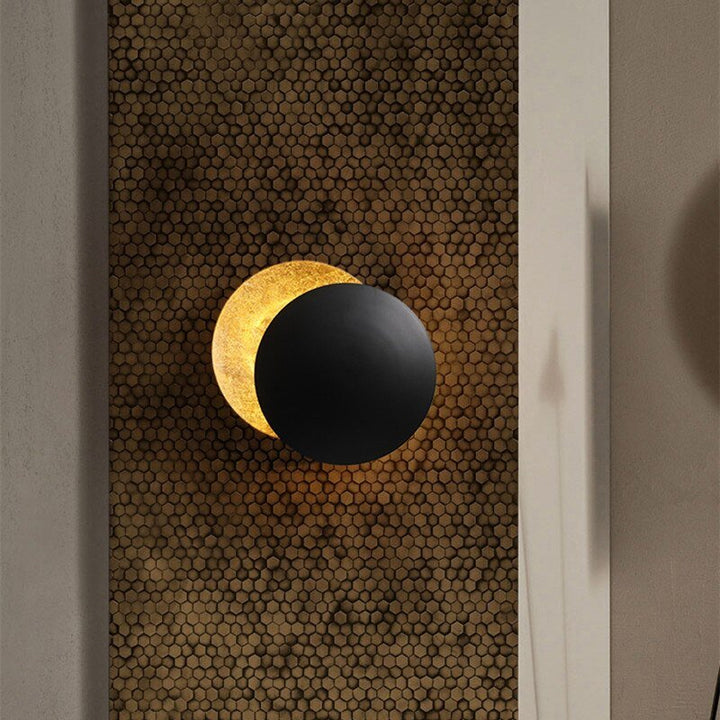 Ambient LED wall lamp with a unique solar eclipse design, modern and elegant.