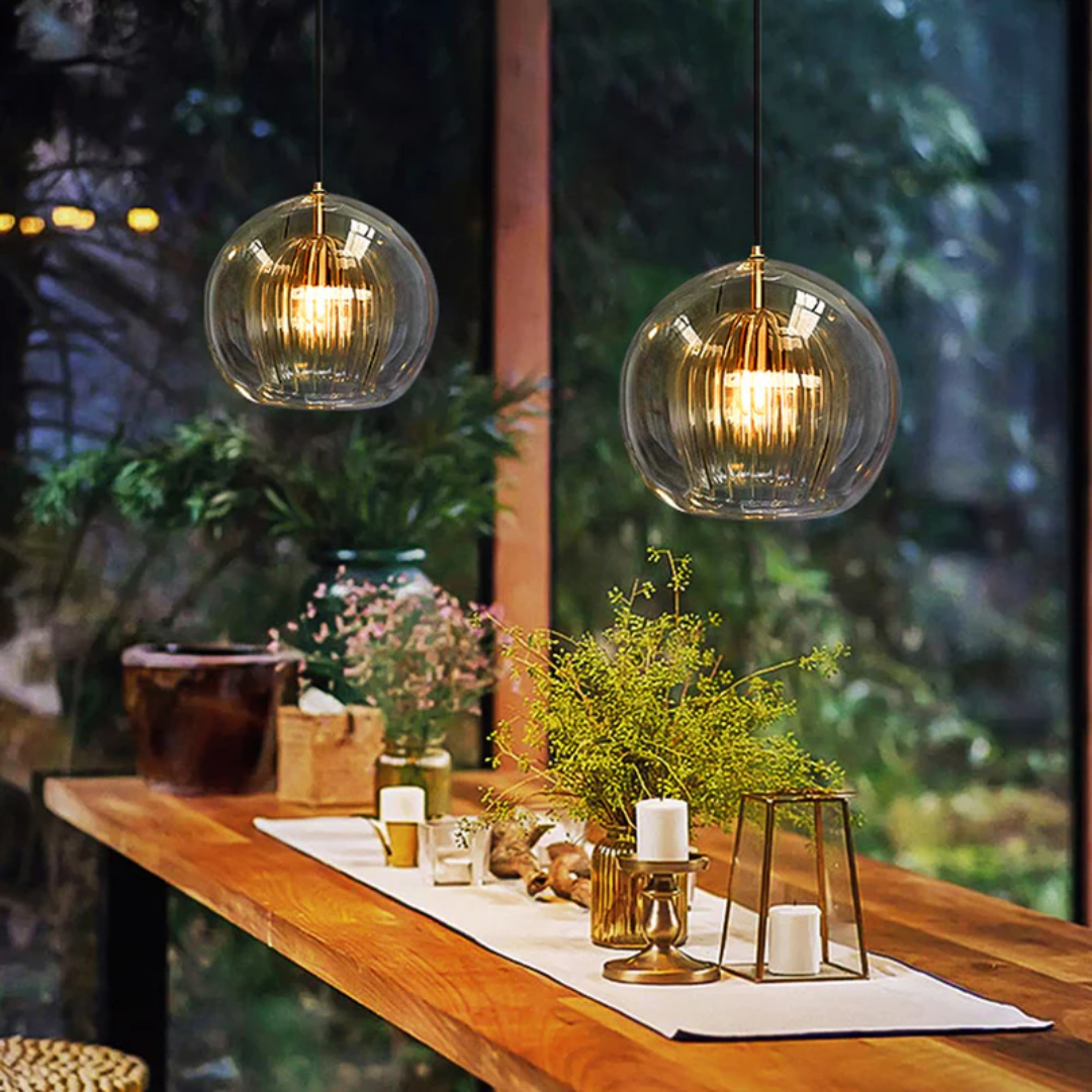 Contemporary Aurora Sphere LED pendant light, spherical design, adjustable, warm white indoor lighting fixture.