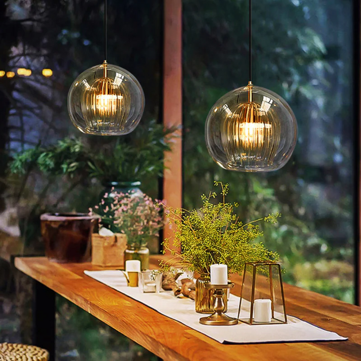 Contemporary Aurora Sphere LED pendant light, spherical design, adjustable, warm white indoor lighting fixture.